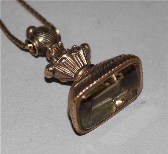 A Victorian gold overlaid and smoky quartz set seal on 9ct chain, seal 1.5in.